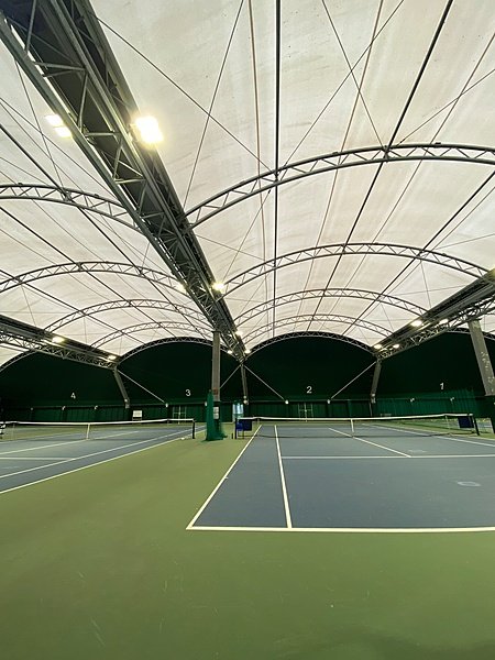 The canopied tennis courts at Culford School allow tennis all year round