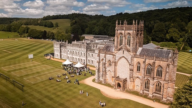 areal view of the impressive Abbey with the rest of the campus of Milton Abbey school
