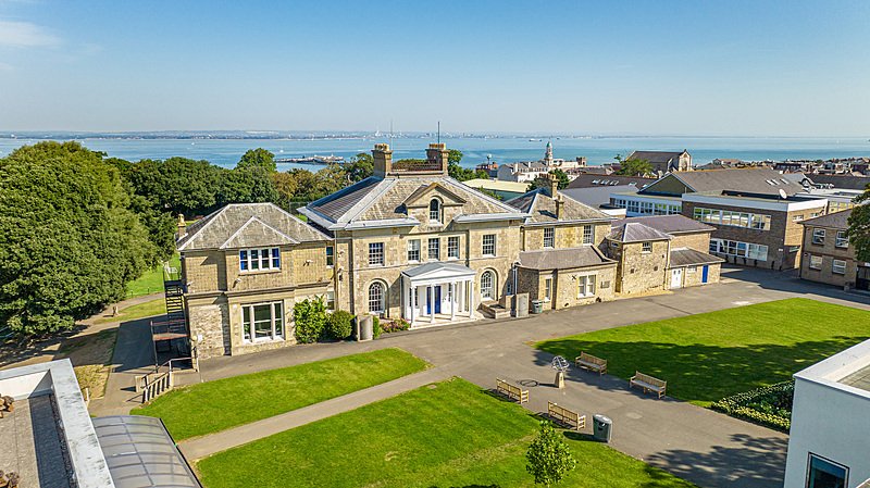 Areal view of the main building at Ryde School with the sea behind