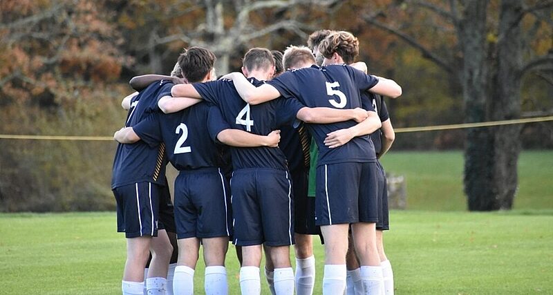 team huddle on the football pitch at Ardingly College