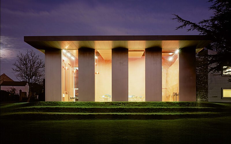 A well-lit, modern building with very long windows