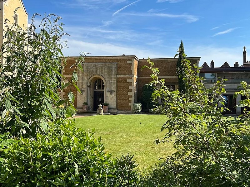 Green and a house in the background