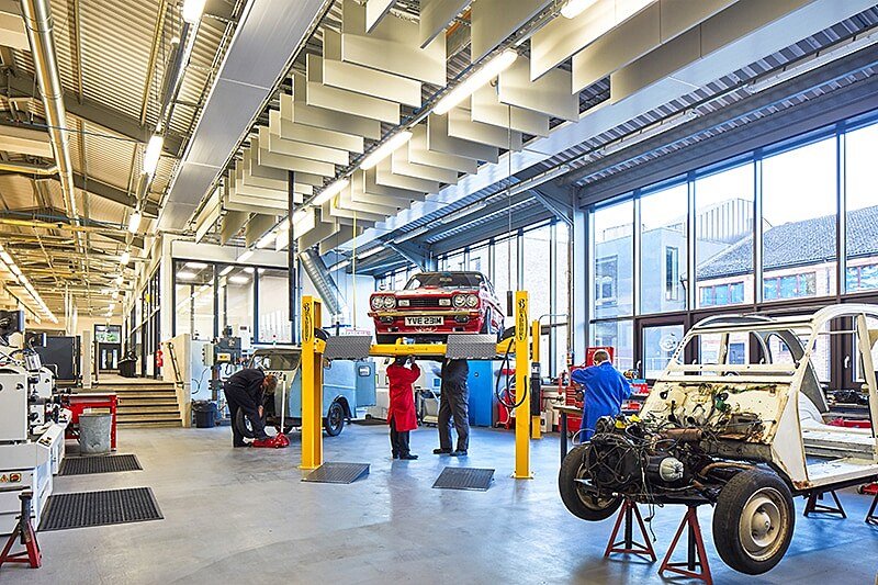 the schools own car fixing garage with a hydraulic lift and impressive equipment