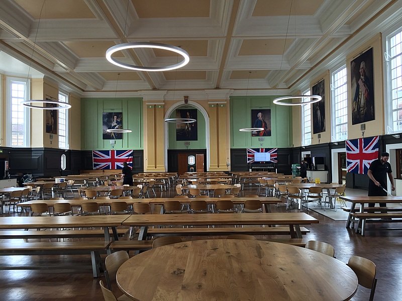 the massive dining hall at Royal Hospital School with long wooden benches and tables