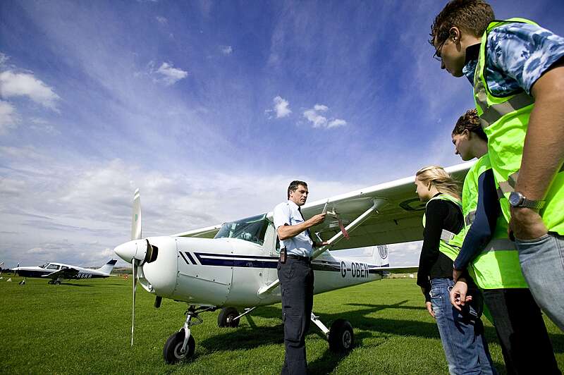 Bede's Summer School Flying Lessons Instructor and students in front of plane