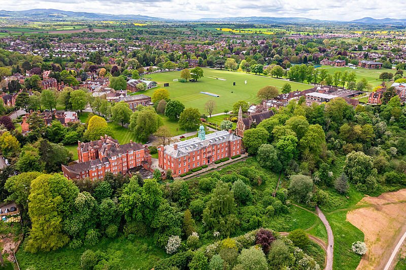 Areal view of Shrewsbury School and its green campus and forest